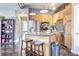 Modern kitchen with stainless steel appliances, island with stools, and sleek finishes at 350 Peters Sw St # 19, Atlanta, GA 30313