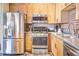 Contemporary kitchen with stainless steel appliances and wooden cabinets at 350 Peters Sw St # 19, Atlanta, GA 30313