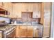 Updated kitchen with stainless steel appliances, wood cabinets, and a gas range at 350 Peters Sw St # 19, Atlanta, GA 30313