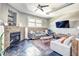 Bright living room featuring an exposed brick wall, fireplace, and large windows at 350 Peters Sw St # 19, Atlanta, GA 30313