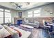 Comfortable living room with exposed brick wall, fireplace, ceiling fan, and plenty of natural light at 350 Peters Sw St # 19, Atlanta, GA 30313