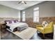Spacious main bedroom with a comfortable bed, exposed brick, and ample natural light at 350 Peters Sw St # 19, Atlanta, GA 30313