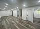 Finished basement with modern flooring, recessed lighting and an open floor plan at 4651 S Roberts Drive, Sugar Hill, GA 30518