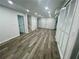 Finished basement featuring gray wood flooring, neutral walls, recessed lighting, and closet space at 4651 S Roberts Drive, Sugar Hill, GA 30518