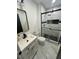 Renovated bathroom featuring a glass shower and updated fixtures at 4651 S Roberts Drive, Sugar Hill, GA 30518