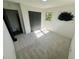 Bright bedroom featuring neutral carpet, closet, and natural light at 4651 S Roberts Drive, Sugar Hill, GA 30518