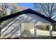 Home's carport area features painted brick columns and a covered parking space at 4651 S Roberts Drive, Sugar Hill, GA 30518