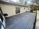 Large rear deck with gray wood and dark trim provides outdoor living and entertainment space at 4651 S Roberts Drive, Sugar Hill, GA 30518