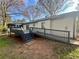 Rear deck and patio area features ample space, railing, and a wheelchair access ramp at 4651 S Roberts Drive, Sugar Hill, GA 30518