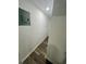 Hallway featuring modern flooring and neutral paint at 4651 S Roberts Drive, Sugar Hill, GA 30518