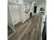 Kitchen showcases white cabinetry, stone countertops, and an open concept layout at 4651 S Roberts Drive, Sugar Hill, GA 30518