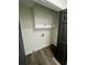 Laundry room with washer/dryer hookups and storage cabinets at 4651 S Roberts Drive, Sugar Hill, GA 30518