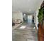Open-concept living space with modern flooring, neutral decor, and access to a deck at 4651 S Roberts Drive, Sugar Hill, GA 30518