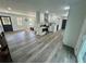 The open concept living area features modern decor and a seamless flow to the kitchen at 4651 S Roberts Drive, Sugar Hill, GA 30518
