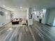 Open floor plan showcasing the living room flowing into the updated kitchen at 4651 S Roberts Drive, Sugar Hill, GA 30518