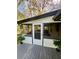 Cozy screened-in porch features a door, screens, and outdoor views at 4651 S Roberts Drive, Sugar Hill, GA 30518