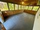 Large screened porch with views and ceiling fans provides a comfortable outdoor space at 4651 S Roberts Drive, Sugar Hill, GA 30518