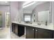 Bathroom with double vanity, cabinets, mirror and natural light at 508 Arbor Trl, Loganville, GA 30052