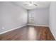 Bedroom with wood floors, window and natural light at 508 Arbor Trl, Loganville, GA 30052