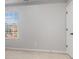 Neutral bedroom with carpet, a window offering natural light, and a white door at 508 Arbor Trl, Loganville, GA 30052