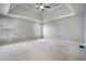 Bedroom with carpet, tray ceiling, windows and natural light at 508 Arbor Trl, Loganville, GA 30052