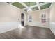 Spacious dining room features hardwood floors, coffered ceilings, and natural light at 508 Arbor Trl, Loganville, GA 30052