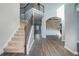 The foyer boasts soaring ceilings, hardwood floors, and an elegant staircase at 508 Arbor Trl, Loganville, GA 30052