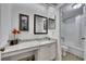 Bright bathroom has granite countertop, vanity, and bathtub with shower at 810 Lismore Se # 10, Smyrna, GA 30080