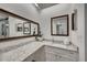 Bathroom vanity with a granite countertop, a decorative mirror, and a sink at 810 Lismore Se # 10, Smyrna, GA 30080
