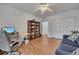 Cozy bedroom features a ceiling fan, closet, and hardwood floors at 810 Lismore Se # 10, Smyrna, GA 30080