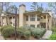 Inviting exterior view of a two-story condo with well-maintained landscaping at 810 Lismore Se # 10, Smyrna, GA 30080