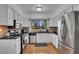 Bright kitchen showcasing stainless steel appliances, white cabinets, and a modern design for efficient cooking at 810 Lismore Se # 10, Smyrna, GA 30080