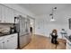 Spacious kitchen featuring stainless steel fridge, white cabinets, and an open layout at 810 Lismore Se # 10, Smyrna, GA 30080
