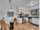 Well-lit kitchen featuring stainless steel appliances, white cabinets, and a charming breakfast nook with two chairs at 810 Lismore Se # 10, Smyrna, GA 30080