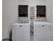 Laundry room has a side-by-side washer and dryer setup, with storage at 810 Lismore Se # 10, Smyrna, GA 30080