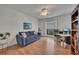 Comfortable living room offering a blend of relaxation and functionality with a desk and bookshelf at 810 Lismore Se # 10, Smyrna, GA 30080