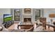 Relaxing living area with fireplace, wood floors and brown sofa at 810 Lismore Se # 10, Smyrna, GA 30080