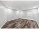 Finished basement featuring wood-look flooring and a window at 1870 Abercorn Way, Snellville, GA 30078