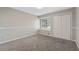 Bedroom featuring a window seat, double-door closet and neutral carpeting at 1870 Abercorn Way, Snellville, GA 30078