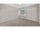 Cozy bedroom with neutral carpet, natural light, and a closet at 1870 Abercorn Way, Snellville, GA 30078