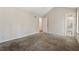 Carpeted bedroom featuring a doorway to the bathroom and closet at 1870 Abercorn Way, Snellville, GA 30078