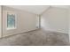 Carpeted bedroom with vaulted ceiling and two windows for natural light at 1870 Abercorn Way, Snellville, GA 30078