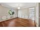 Elegant dining room featuring decorative wall paneling and a large window with tree view at 1870 Abercorn Way, Snellville, GA 30078