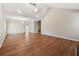 Open-concept living room with hardwood floors and decorative wall paneling perfect for entertaining at 1870 Abercorn Way, Snellville, GA 30078
