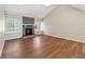 Spacious living room featuring vaulted ceilings, large windows, and a cozy stone fireplace at 1870 Abercorn Way, Snellville, GA 30078
