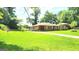 Inviting home with a spacious front yard and classic brick exterior in a serene setting at 2213 Sharon Way, Decatur, GA 30032