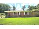 Charming brick home with a well-maintained lawn and a classic, inviting facade at 2213 Sharon Way, Decatur, GA 30032