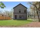 View of the home's backyard, showcasing a lush lawn and the clean, modern lines of the house's exterior at 1249 Ladd Sw St, Atlanta, GA 30310