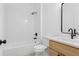 Clean, well-lit bathroom featuring a tub/shower combo and vanity with a sleek, modern design at 1249 Ladd Sw St, Atlanta, GA 30310