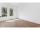 An empty bedroom with lots of natural light provided by two windows with beautiful views at 1249 Ladd Sw St, Atlanta, GA 30310